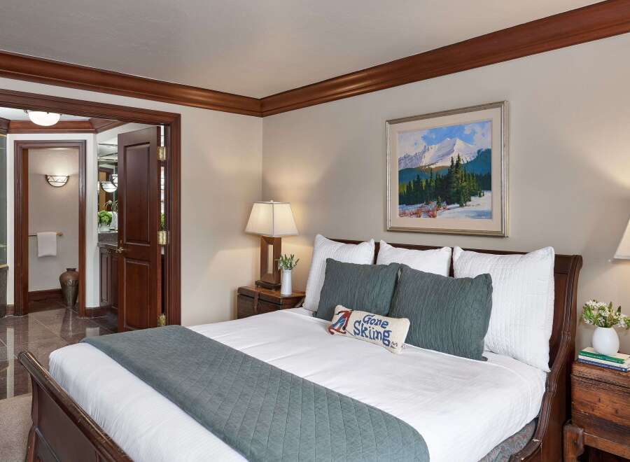 Step into luxury with this beautifully appointed bedroom, featuring a cozy king-sized bed and elegant decor.