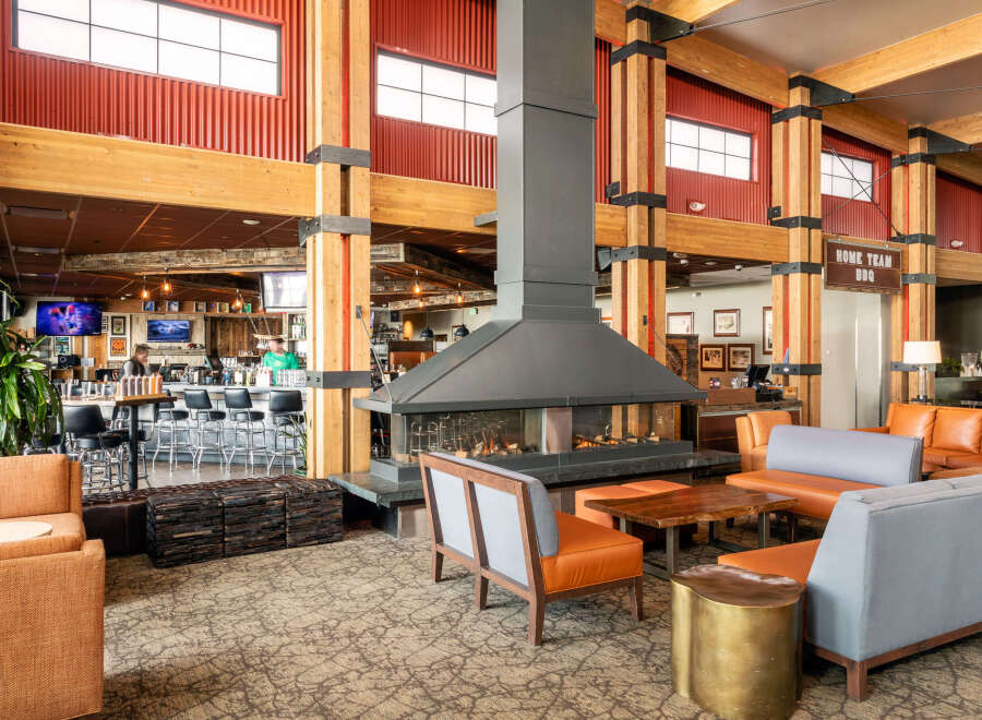 Step into the inviting ambiance of this stunning property, featuring a cozy fireplace and stylish seating areas.