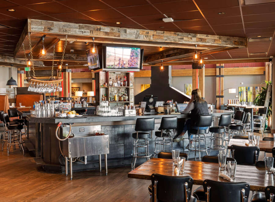 This inviting restaurant features a rustic bar area with a cozy atmosphere.