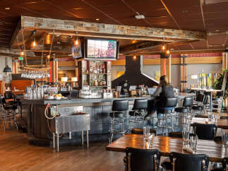 This inviting restaurant features a rustic bar area with a cozy atmosphere.