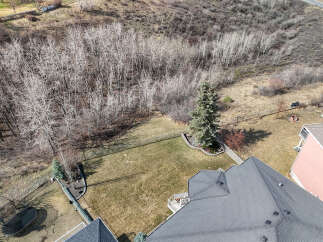 This stunning property boasts a spacious backyard, perfect for outdoor activities and relaxation.