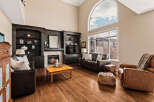 Step into luxury with this stunning living room, featuring a cozy fireplace and elegant built-in shelving.
