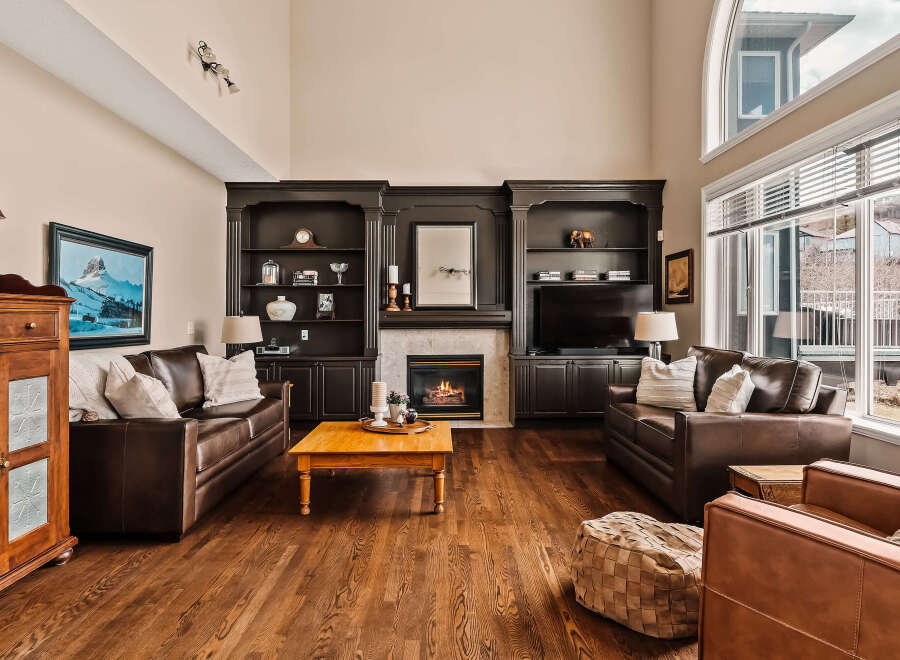 This stunning living room boasts a cozy fireplace, perfect for chilly evenings.