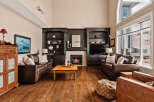 This stunning living room boasts a cozy fireplace, perfect for chilly evenings.