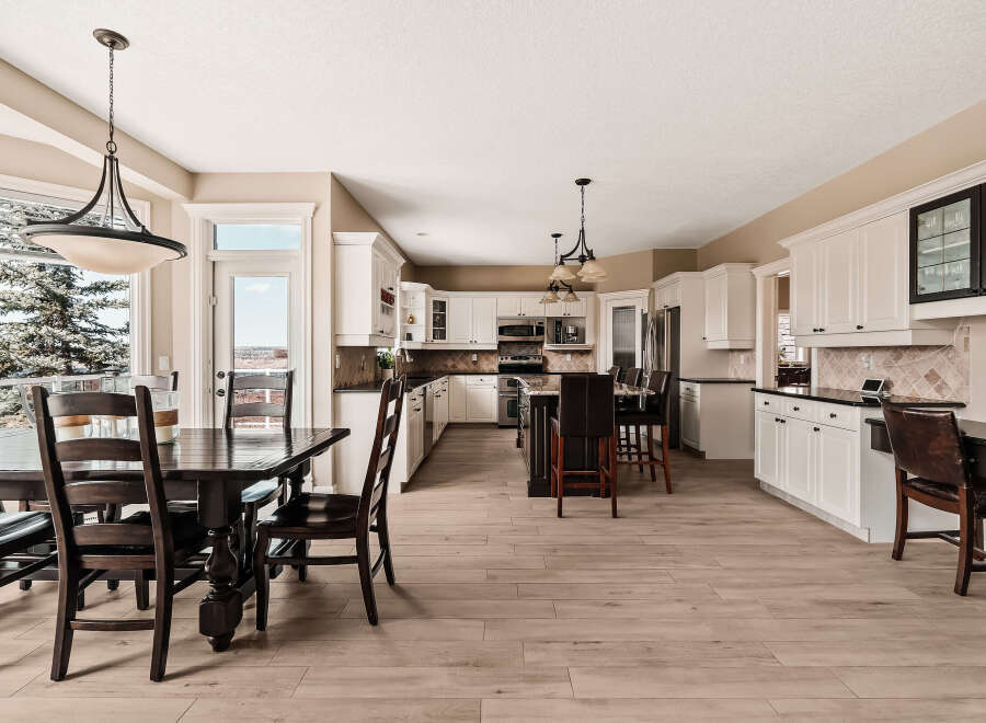 This stunning kitchen and dining area boasts a bright and airy atmosphere, perfect for entertaining or everyday living.