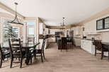 This stunning kitchen and dining area boasts a bright and airy atmosphere, perfect for entertaining or everyday living.