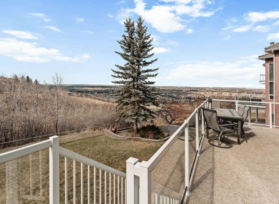 Enjoy breathtaking views from this stunning property featuring a spacious deck perfect for entertaining.