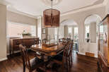 Step into elegance with this stunning dining room, featuring a beautiful wooden table and chairs, perfect for hosting memorable gatherings.