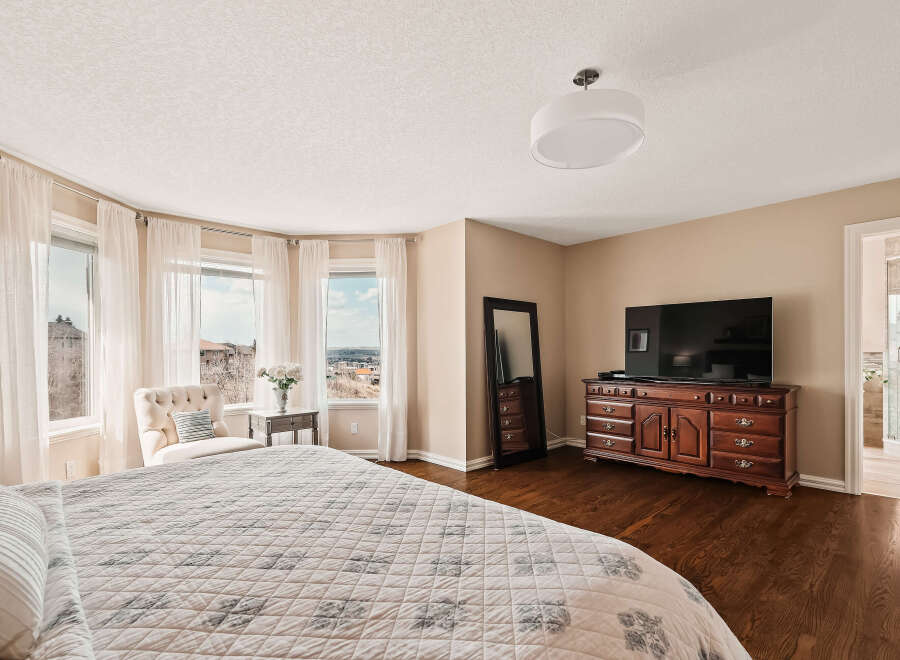 Step into luxury with this stunning bedroom featuring a spacious layout and elegant design.