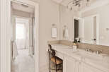 This elegant bathroom boasts a bright and airy design, perfect for a relaxing retreat.