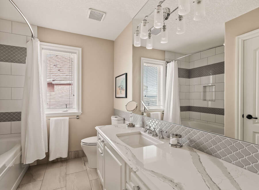 Step into a beautifully designed bathroom featuring elegant finishes and modern amenities.