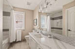 Step into a beautifully designed bathroom featuring elegant finishes and modern amenities.