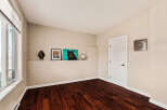 Step into this inviting space, featuring rich hardwood floors and neutral walls that create a warm and welcoming atmosphere.