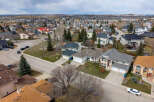Discover the charm of suburban living in this stunning aerial view of a residential neighborhood.