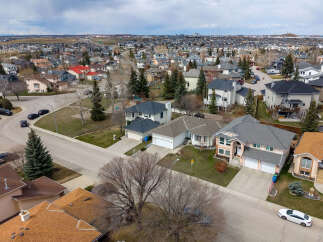 Discover the charm of suburban living in this stunning aerial view of a residential neighborhood.