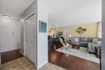 Step into this inviting home featuring a spacious living area with a cozy sectional sofa and a stylish rug.