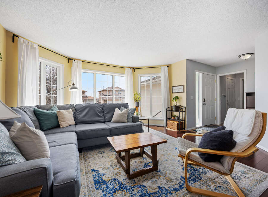 Step into this inviting living space, featuring a cozy sectional sofa perfect for relaxation.
