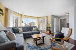 Step into this inviting living space, featuring a cozy sectional sofa perfect for relaxation.