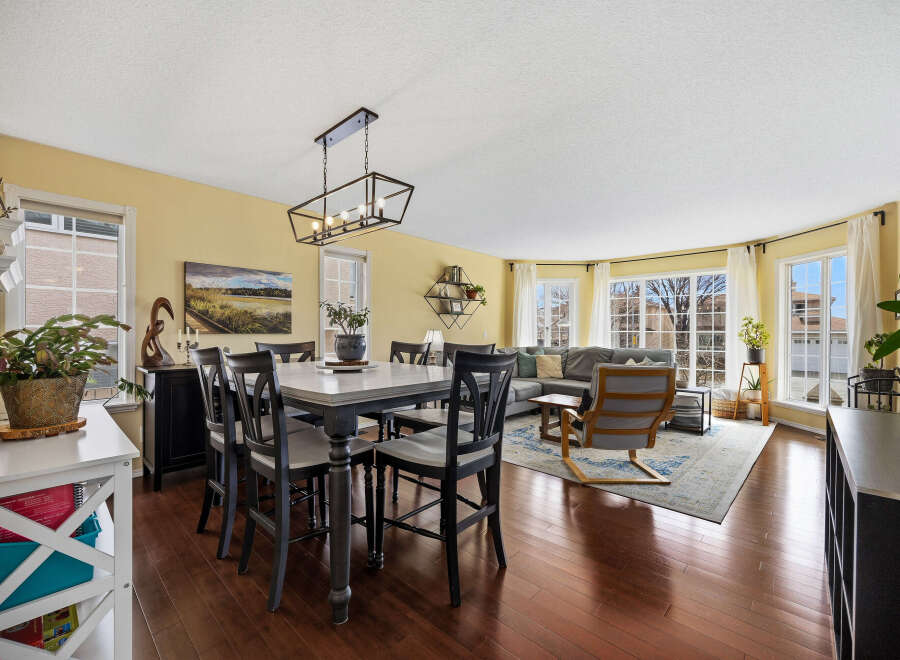 Step into this inviting living space, featuring a stylish dining area perfect for gatherings.