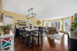 Step into this inviting living space, featuring a stylish dining area perfect for gatherings.