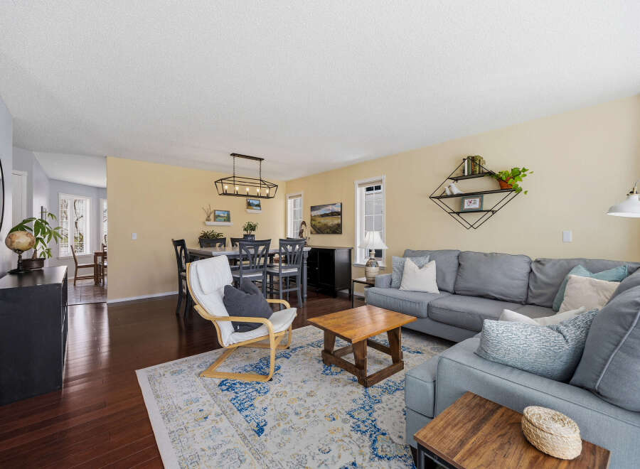Step into this inviting living space, featuring a cozy sectional sofa and a stylish rug that anchors the room.
