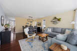 Step into this inviting living space, featuring a cozy sectional sofa and a stylish rug that anchors the room.