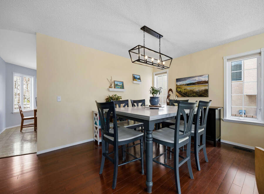 This dining room exudes elegance with its modern farmhouse aesthetic.