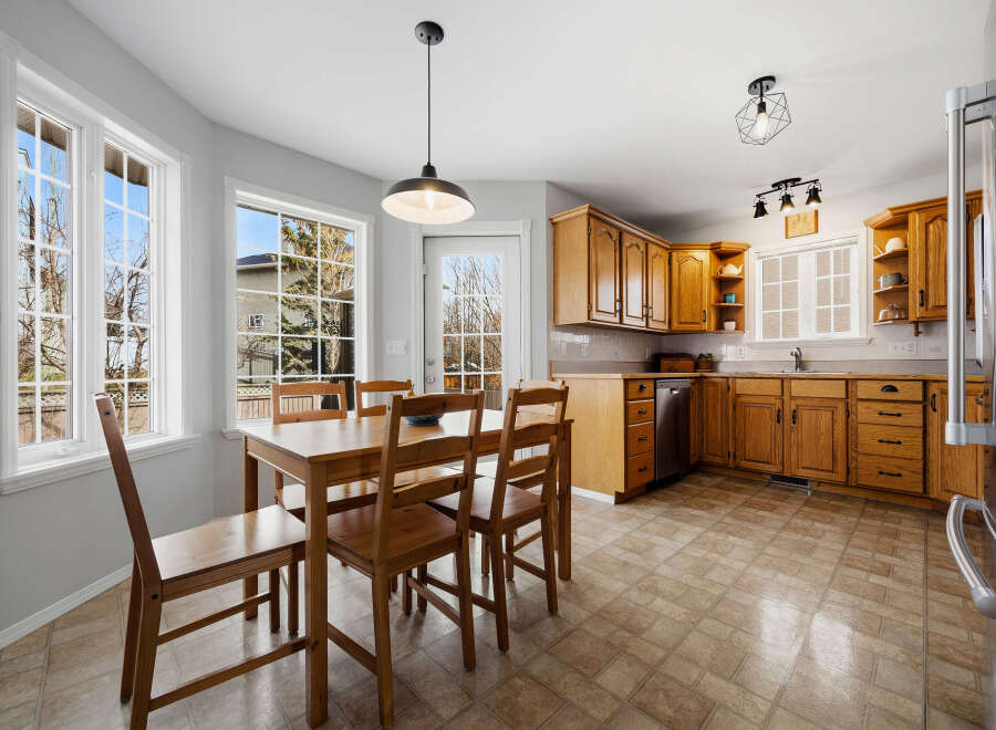 This charming kitchen boasts a warm and inviting atmosphere, perfect for family gatherings and culinary adventures.