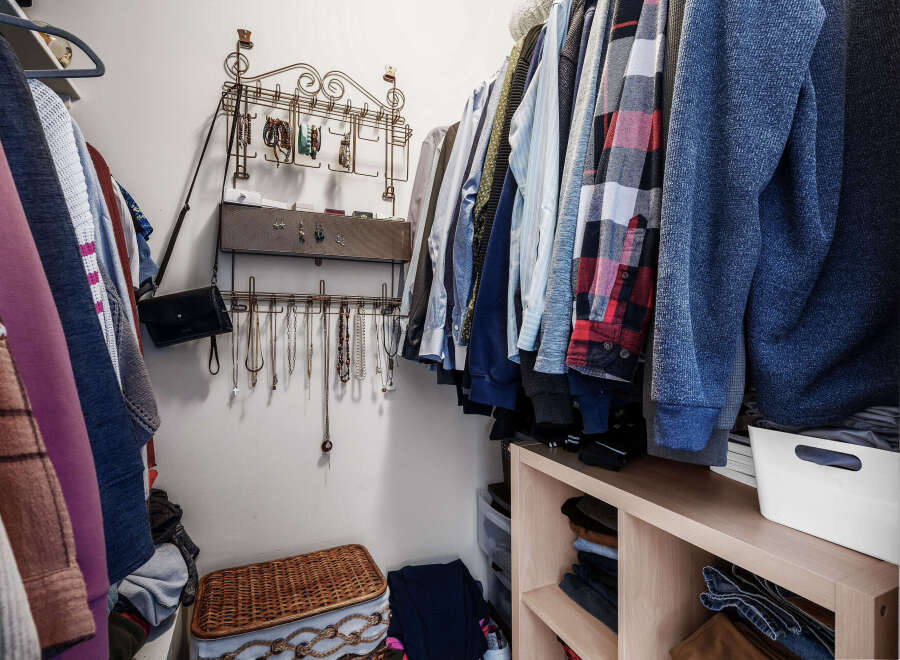 Step into this organized walk-in closet, a perfect blend of style and functionality.