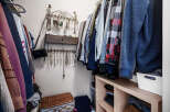 Step into this organized walk-in closet, a perfect blend of style and functionality.