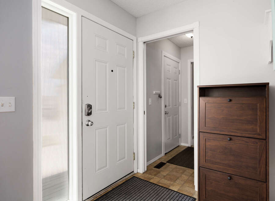 Step into this inviting entryway, showcasing a bright and airy atmosphere.