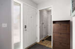 Step into this inviting entryway, showcasing a bright and airy atmosphere.