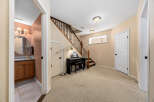 Discover this inviting home featuring a stylish piano area and a convenient powder room.