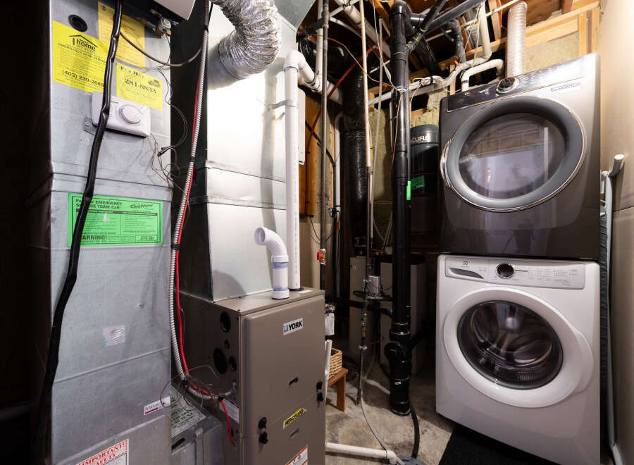 This property features a well-maintained utility room, complete with a modern washer and dryer set.