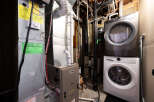 This property features a well-maintained utility room, complete with a modern washer and dryer set.