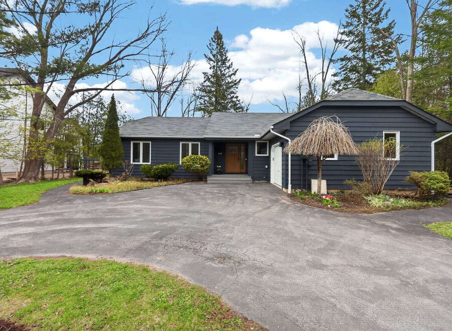 Discover this stunning property featuring a charming exterior and a welcoming driveway.