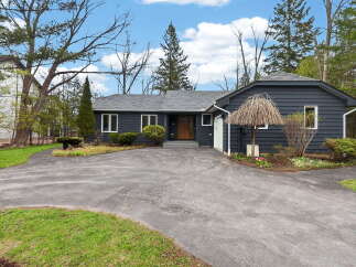 Discover this stunning property featuring a charming exterior and a welcoming driveway.