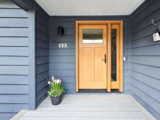 This stunning property boasts a welcoming entrance with a beautiful wooden door and sidelight, creating an inviting first impression.