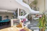 This stunning property boasts a modern design with a spacious open floor plan.