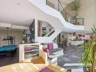 This stunning property boasts a modern design with a spacious open floor plan.