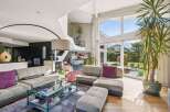 Experience luxury living in this stunning property, featuring a spacious open-plan layout perfect for entertaining.