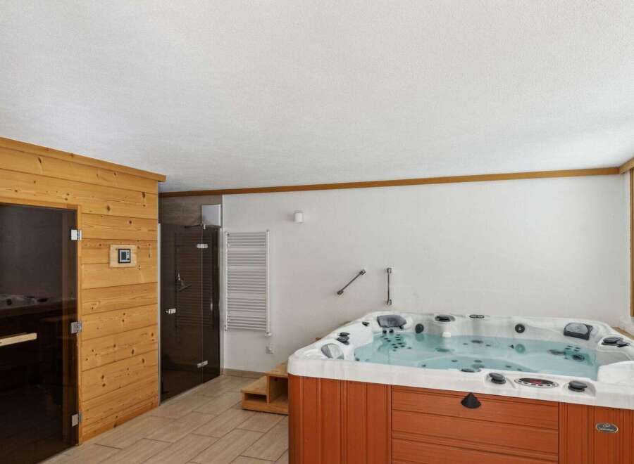 Relax and unwind in this luxurious spa retreat! This property boasts a private sauna and a spacious hot tub, perfect for ultimate relaxation.