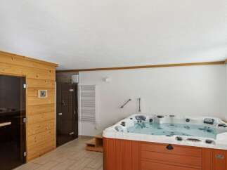 Relax and unwind in this luxurious spa retreat! This property boasts a private sauna and a spacious hot tub, perfect for ultimate relaxation.