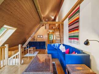 This stunning property boasts a unique architectural design with a cozy, inviting atmosphere.