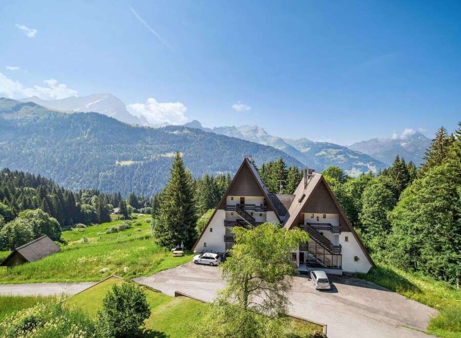 Nestled in a picturesque mountain setting, this stunning property offers a unique architectural design.