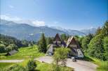 Nestled in a picturesque mountain setting, this stunning property offers a unique architectural design.