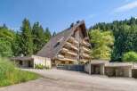Discover this unique A-frame property nestled in a serene, wooded setting.