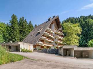 Discover this unique A-frame property nestled in a serene, wooded setting.