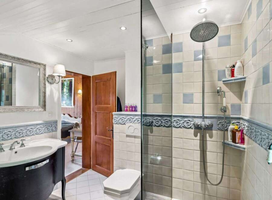Step into this charming bathroom, featuring a blend of classic and modern elements.