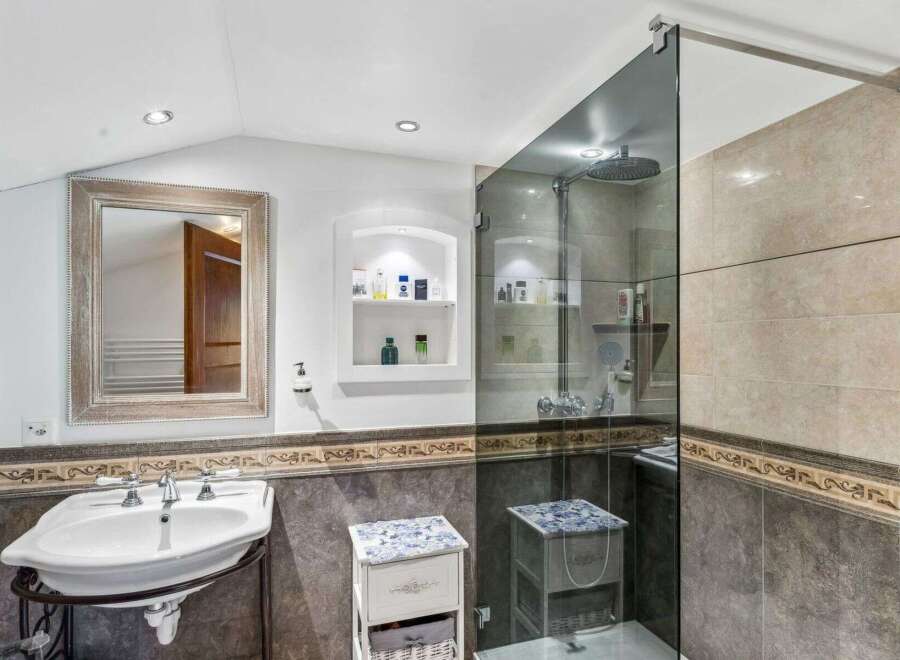 Step into luxury with this stunning bathroom! Featuring a sleek glass shower, elegant sink, and stylish storage solutions, this space is designed for both comfort and sophistication.